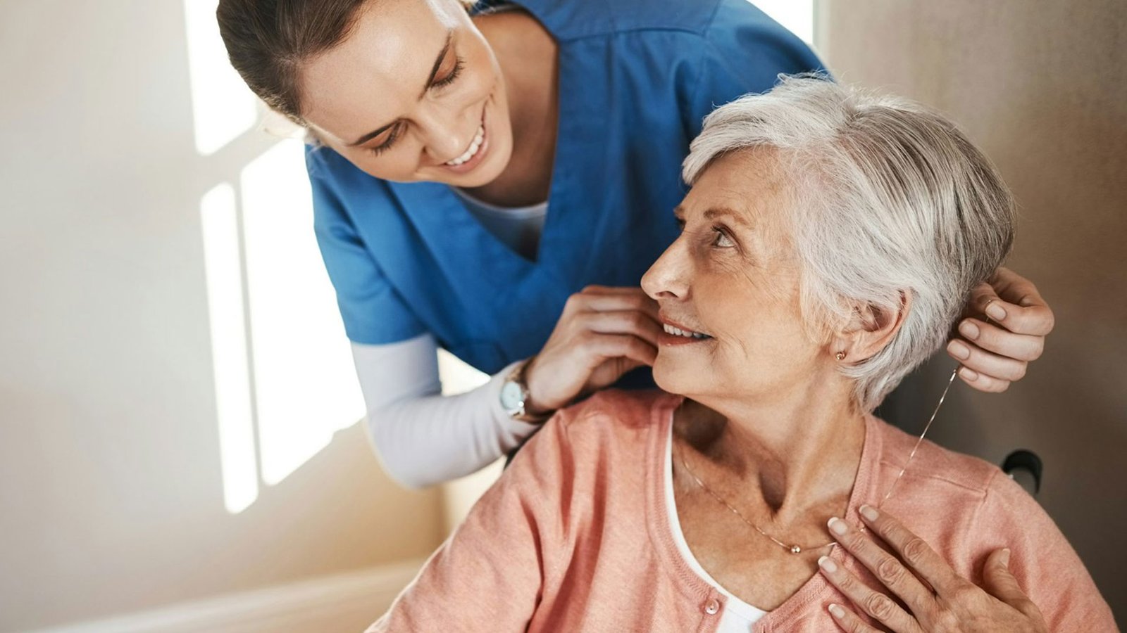 Shot of a senior woman in a wheelchair being cared for a nurse